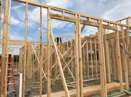 Worker on Roof By Family Room